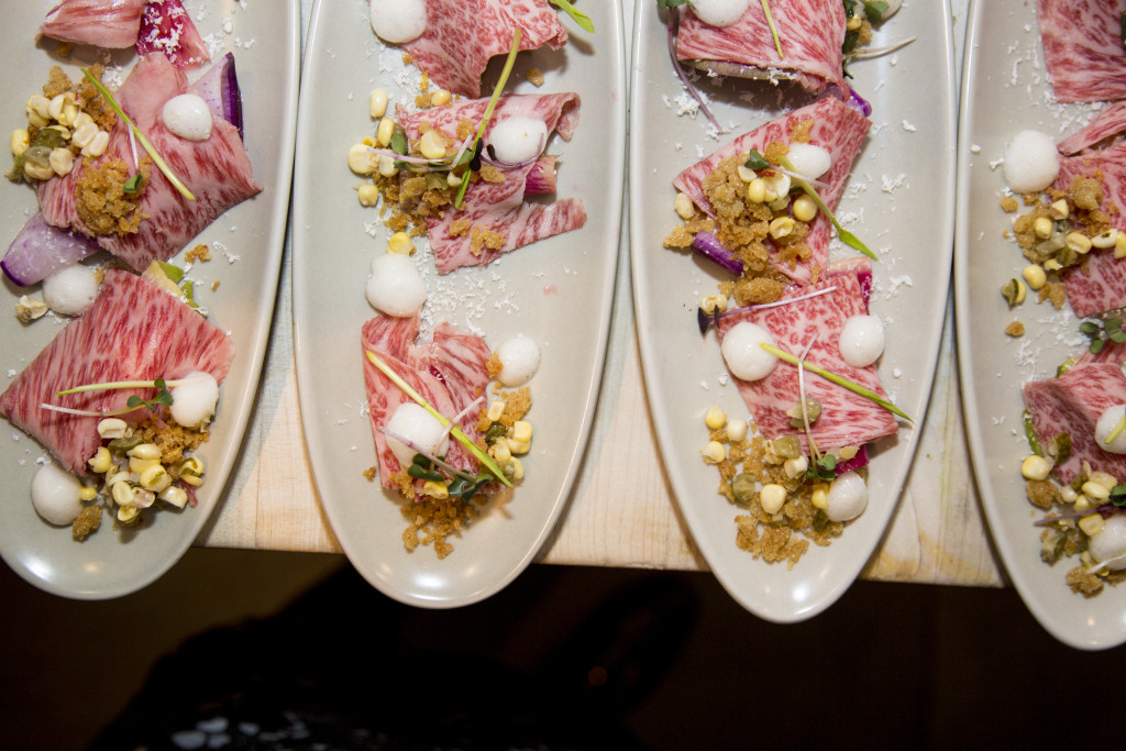 Takeda Farms Reserve Wagyu Beef Crudo with Fermented Corn, Farm Radish, Smoked Foam, Red Fife Bread Crumbs, Shaved Bone Marrow, and Farm Corn Shoots